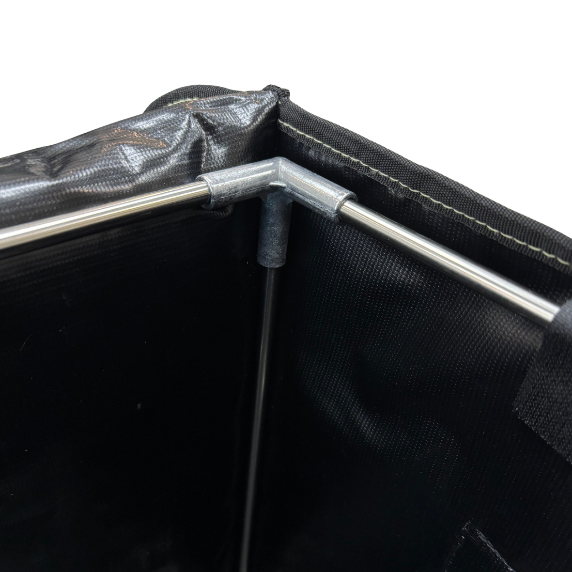 Close-up of a black tent with a metal pole on a white background