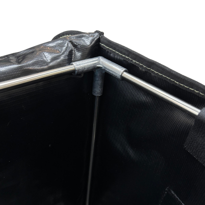 Close-up of a black tent with a metal pole on a white background